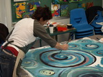 A participant in artist Cynthia Schildhauer's Intuitive Painting workshop